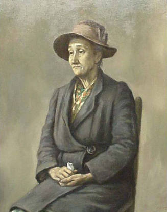 An oil painting of an older woman seated in a plain chair wearing a gray knee length coat, flor…